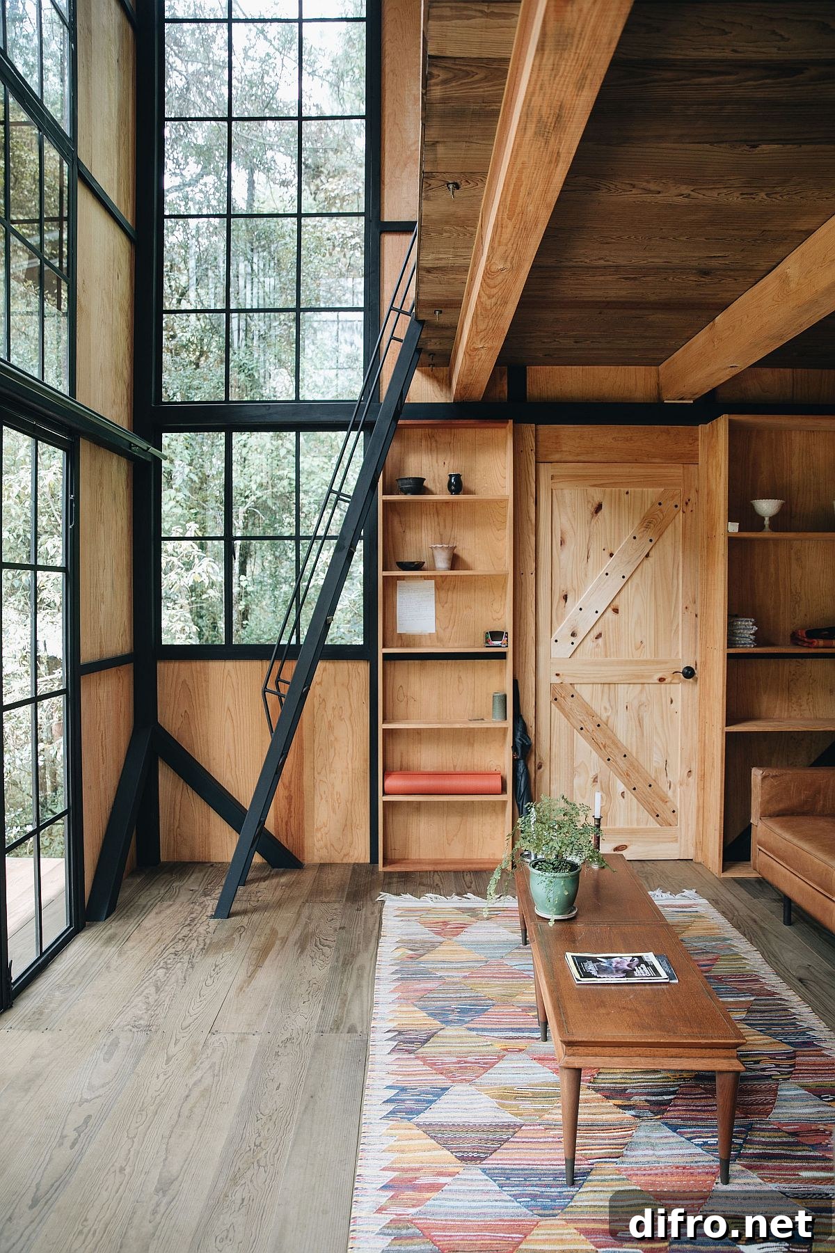 Locally sourced pine wood with glass and metal windows inside the stylish cabin