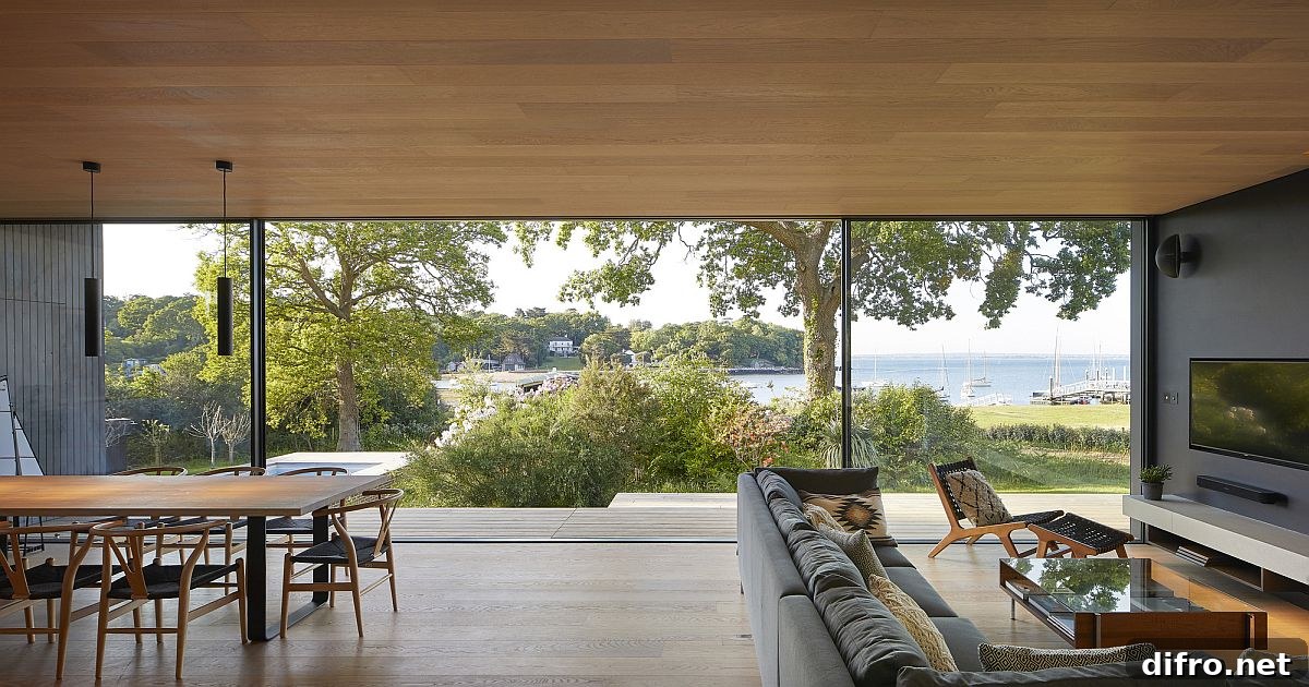 Sliding glass doors opening living and dining towards the English Channel