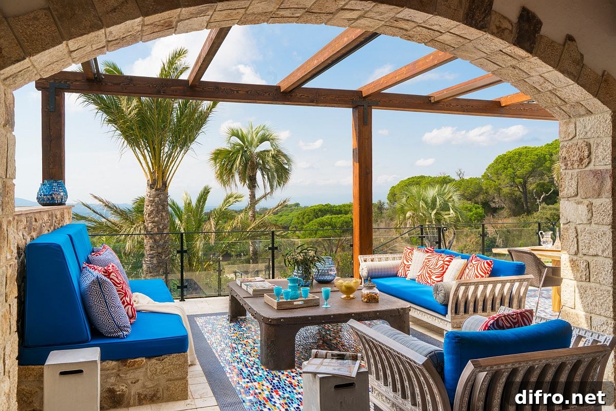 Stone walls and archways add a sense of authenticity to the charming Mediterranean patio
