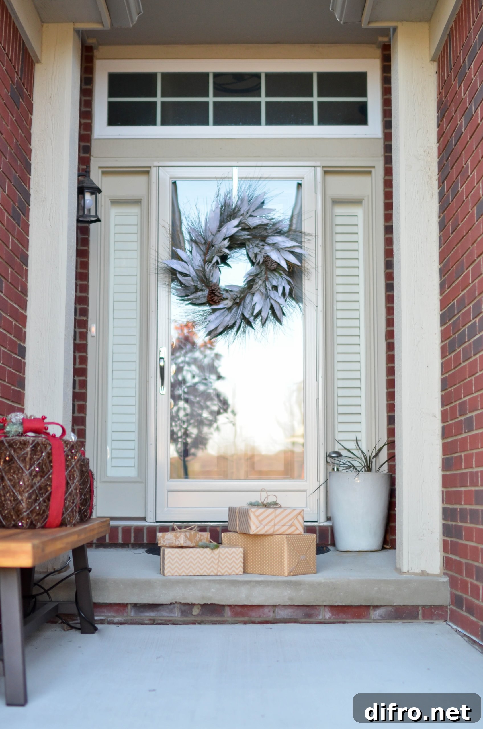 Four brown boxes in front of white glass panel door
