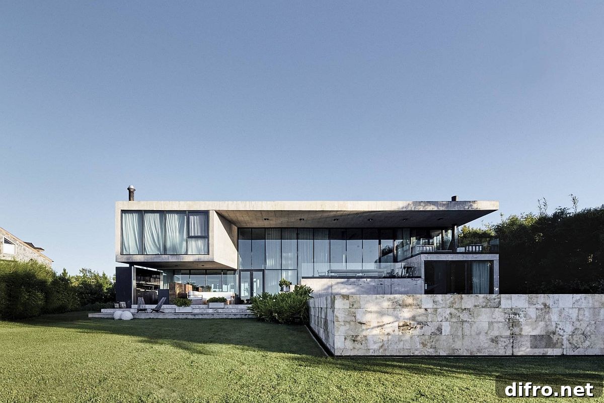 Contemporary rear facade of modern Buenos Aires home with a large outdoor sitting area and pool