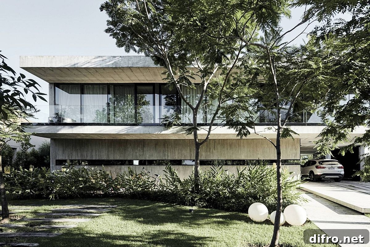 Entryway of the house with a landscaped garden and a meandering pathway