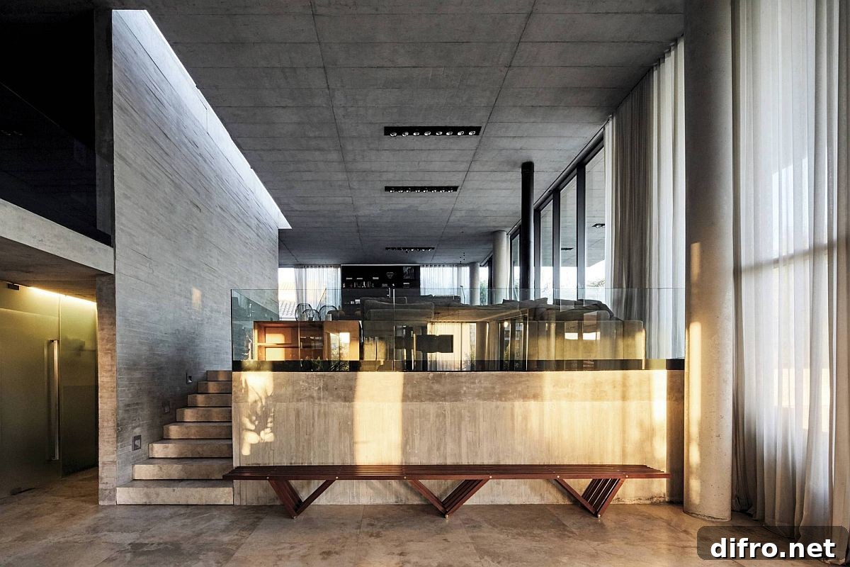 Exposed concrete and wood create the neutral backdrop inside the home