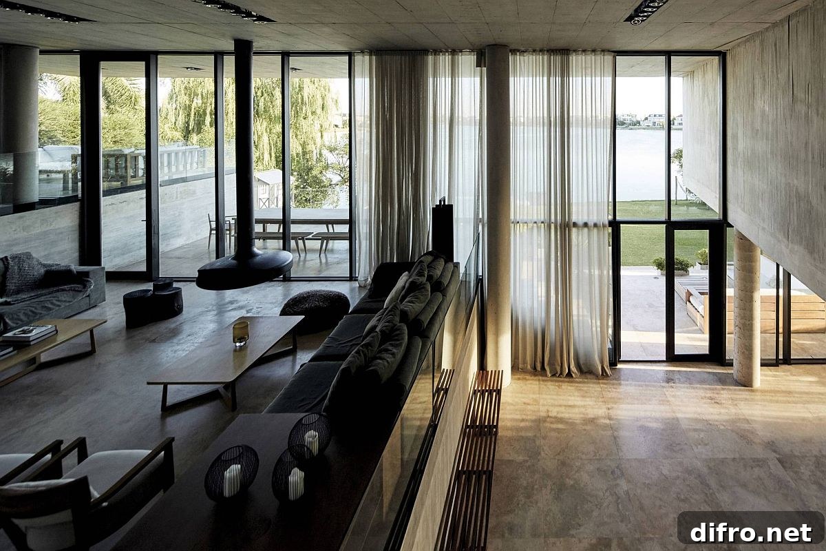 Large sheer curtains filter natural light into the multi-level interior