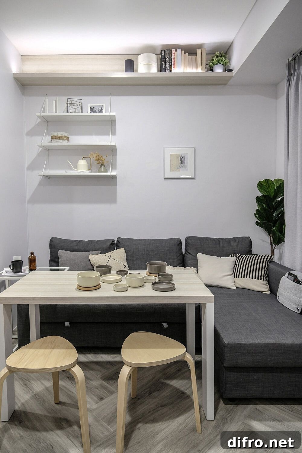 Dining table next to the couch that tucks away