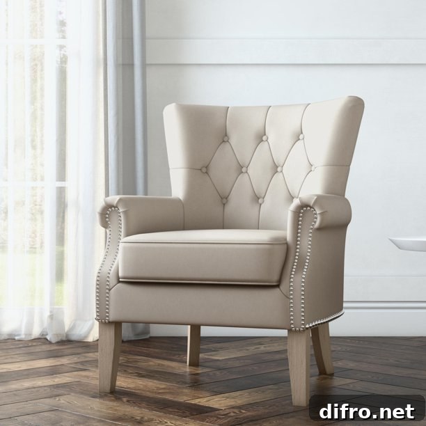 Beige chair with diamond tuft design and nail-head trim