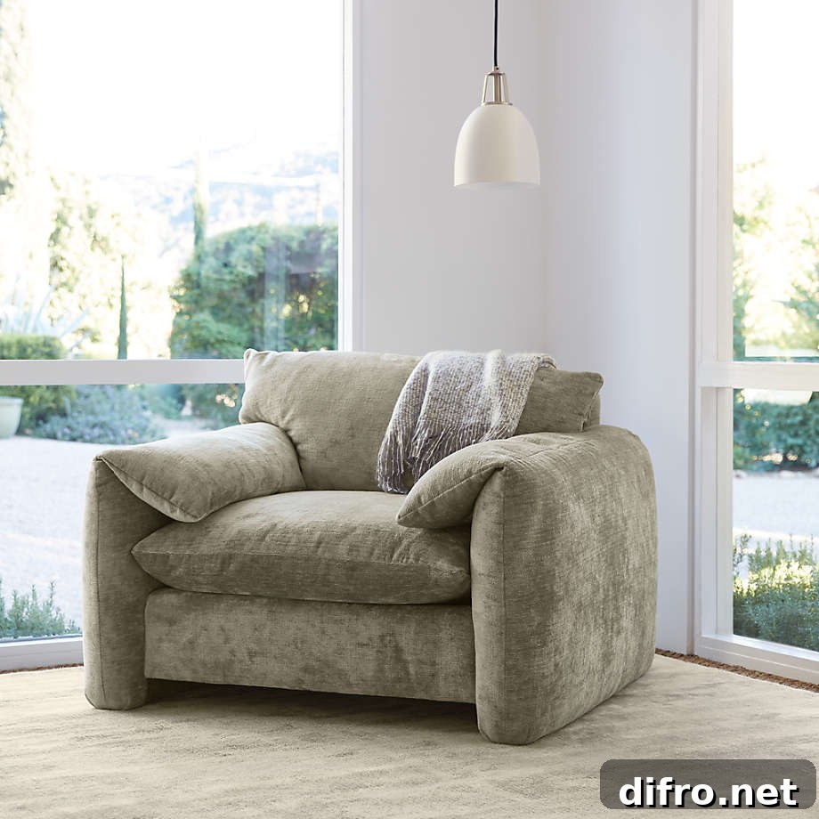 Grey oversized armchair with hanging light