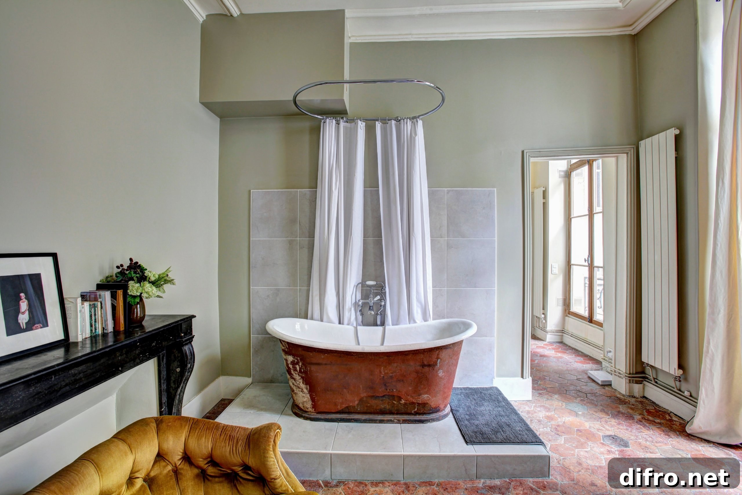 White and brown bath tub on top of elevated tile floor