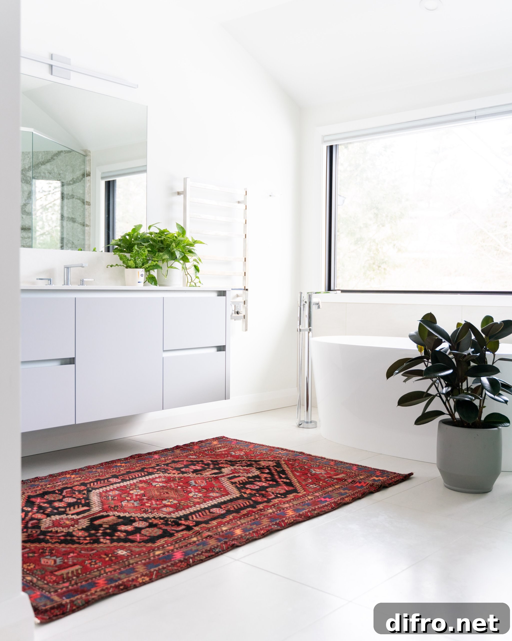 Red patterned rug in an all white bathroom with potted plants