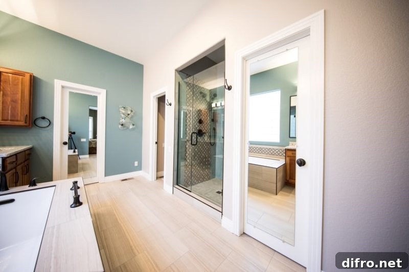 Light colored bathroom with shower stall and tub