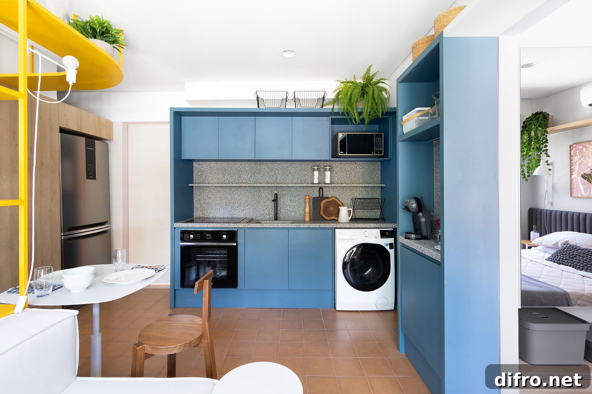 Custom blue cabinets combined with granite countertops in the space-savvy kitchen