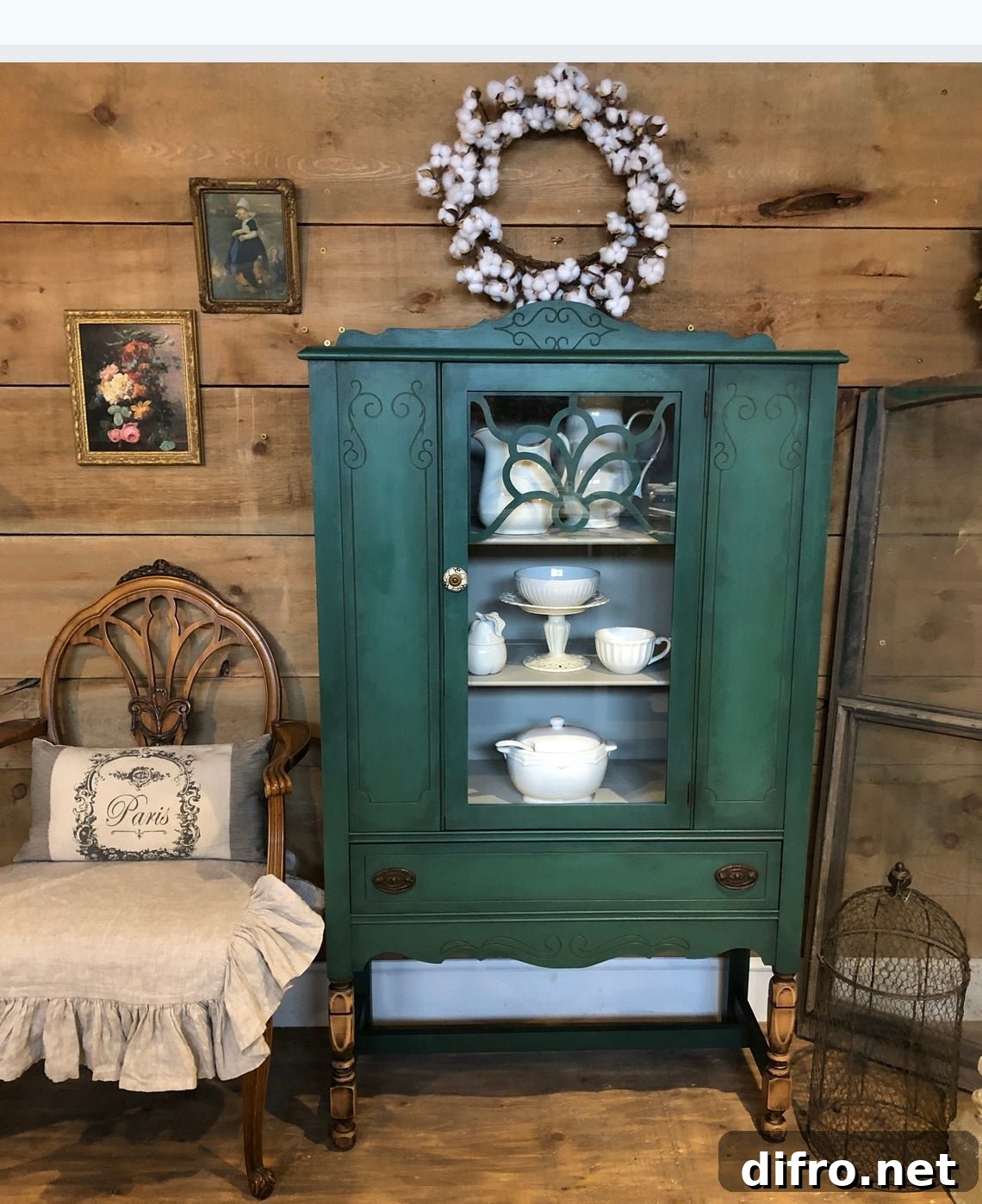 Dark green cabinet with white china
