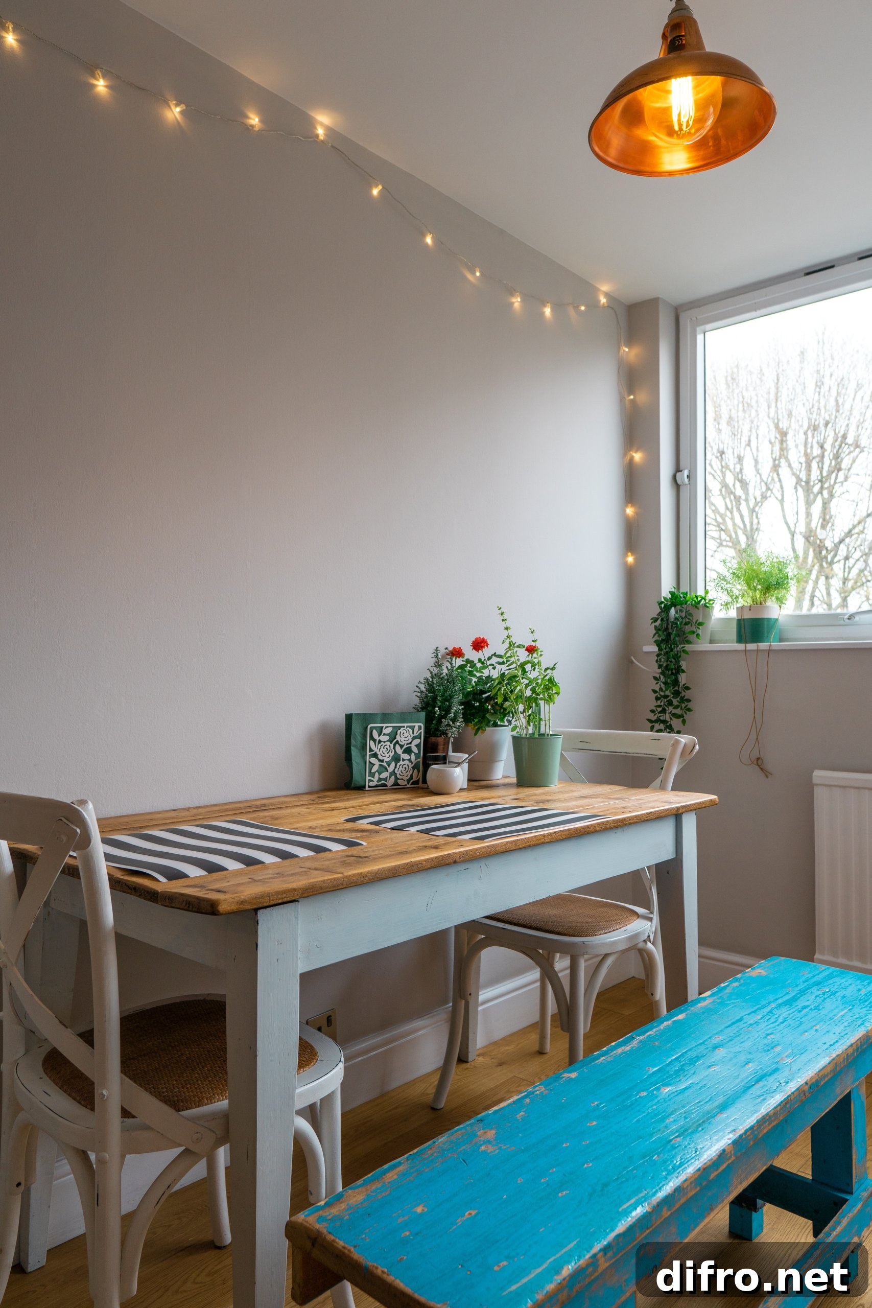 Flower vase on dining table with blue bench