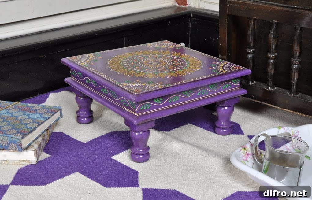 Small purple table with a purple and white carpet underneath