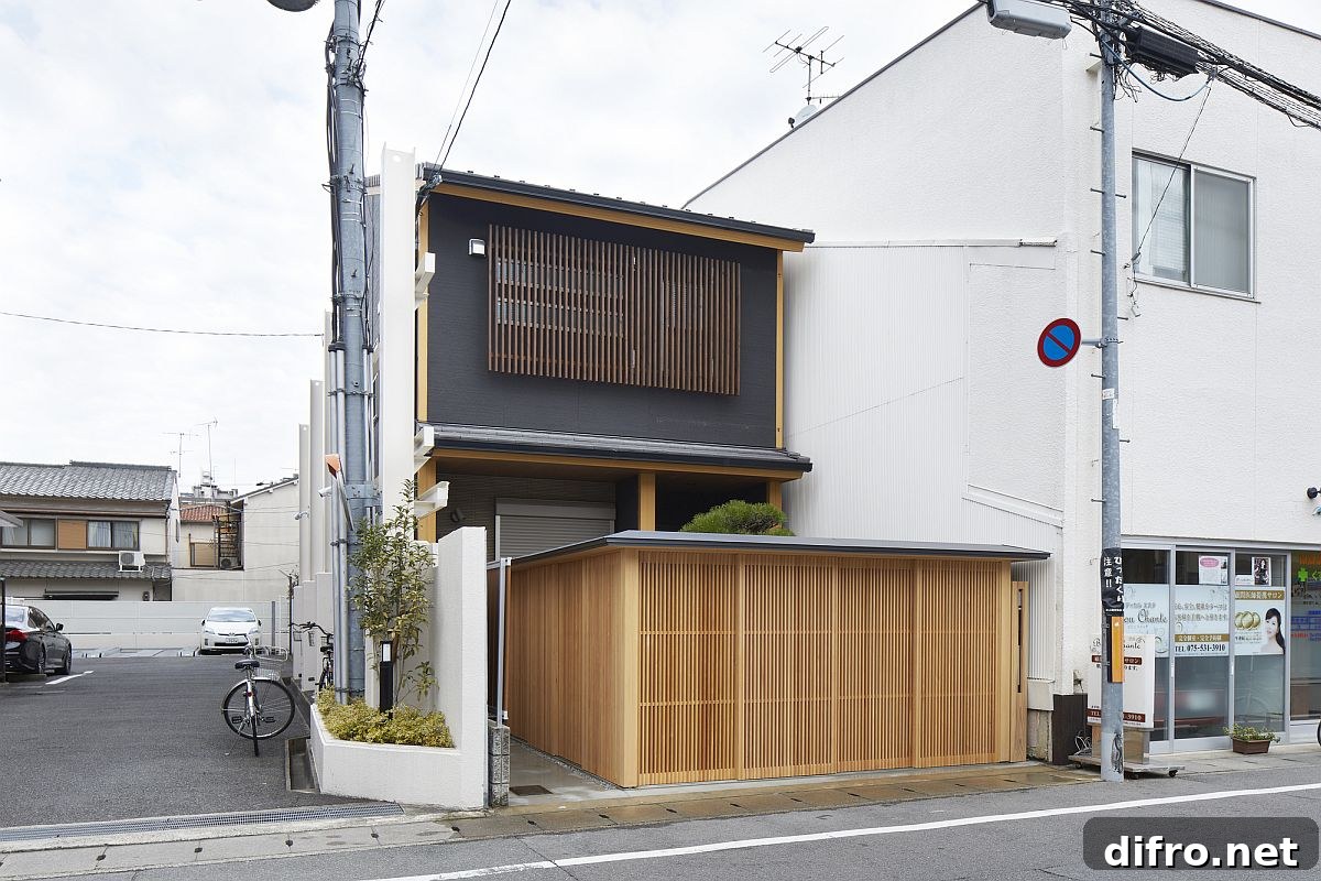 Custom wooden shutters create a contemporary Japanese garden at the front end of this Japanese home