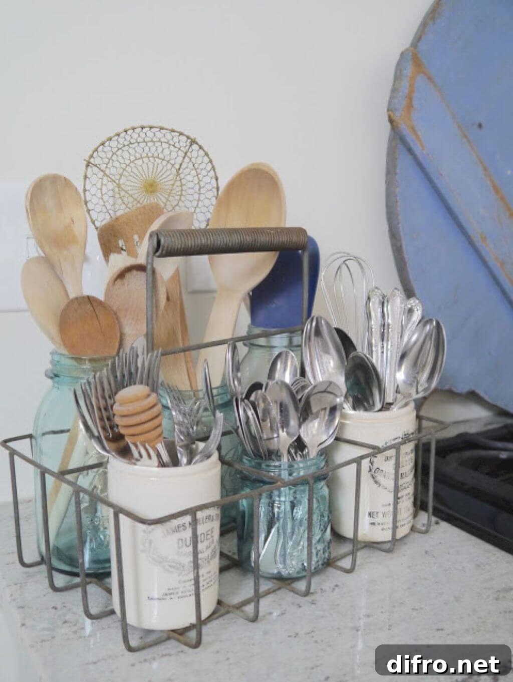 wire utensil caddy with wooden spoon and silverware blue mason jars