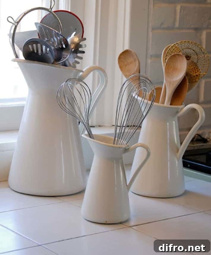 white pitchers with wooden spoons on kitchen counter