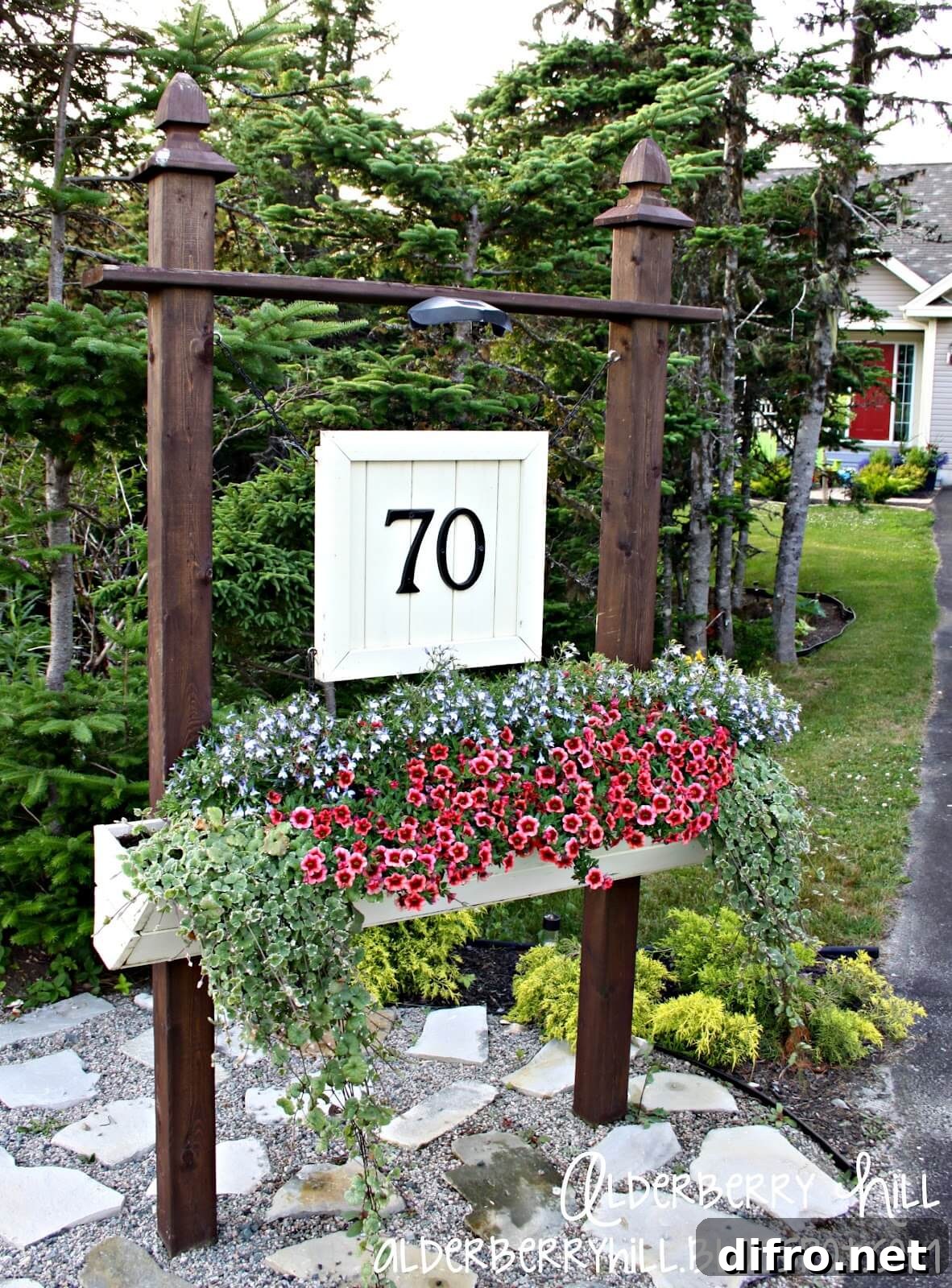 number house sign with planter wood beams on stone garden