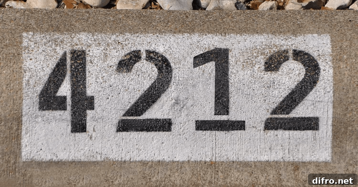 House numbers painted on a sidewalk.