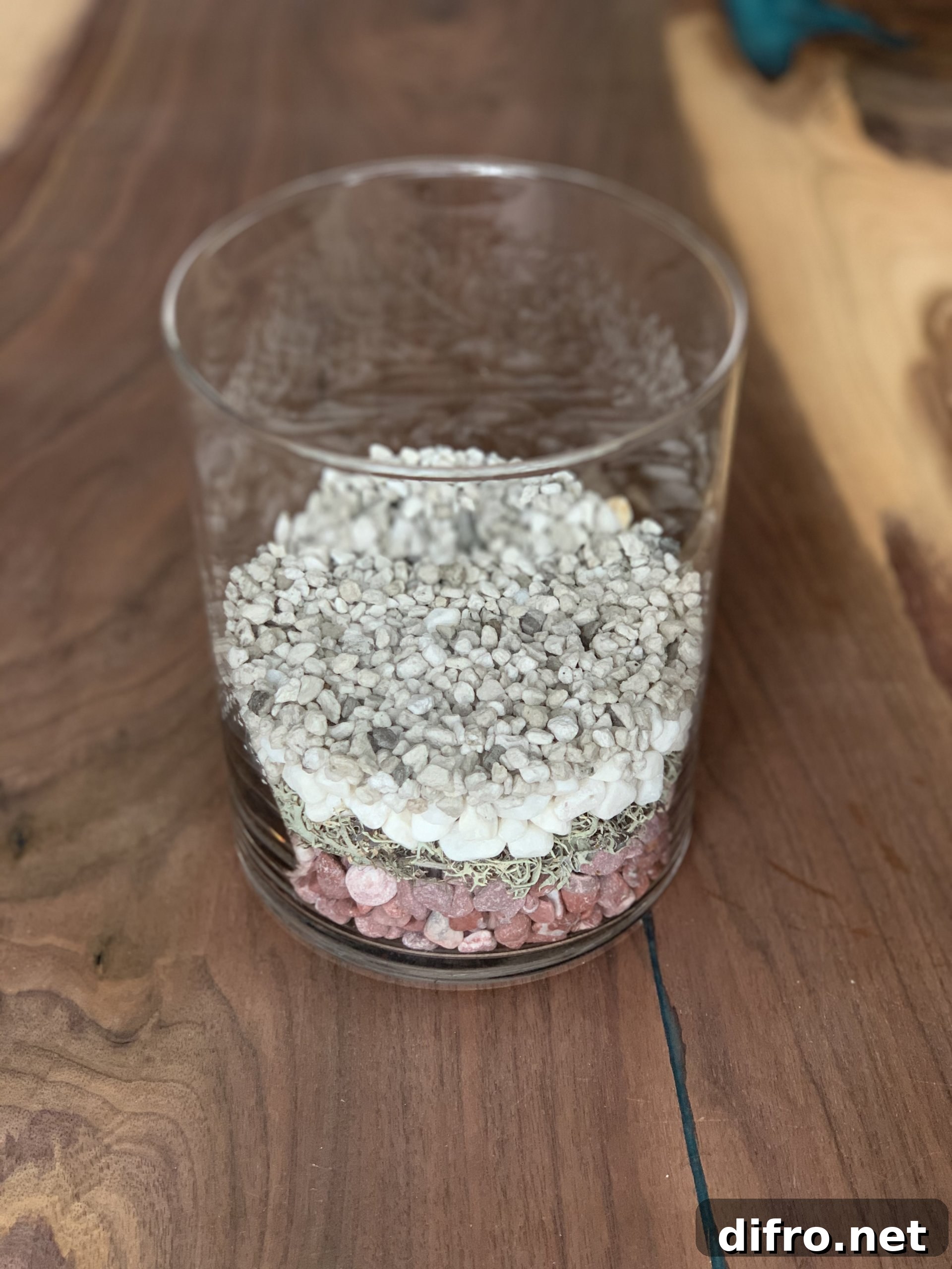 Decorative stones and lava rocks in glass vase