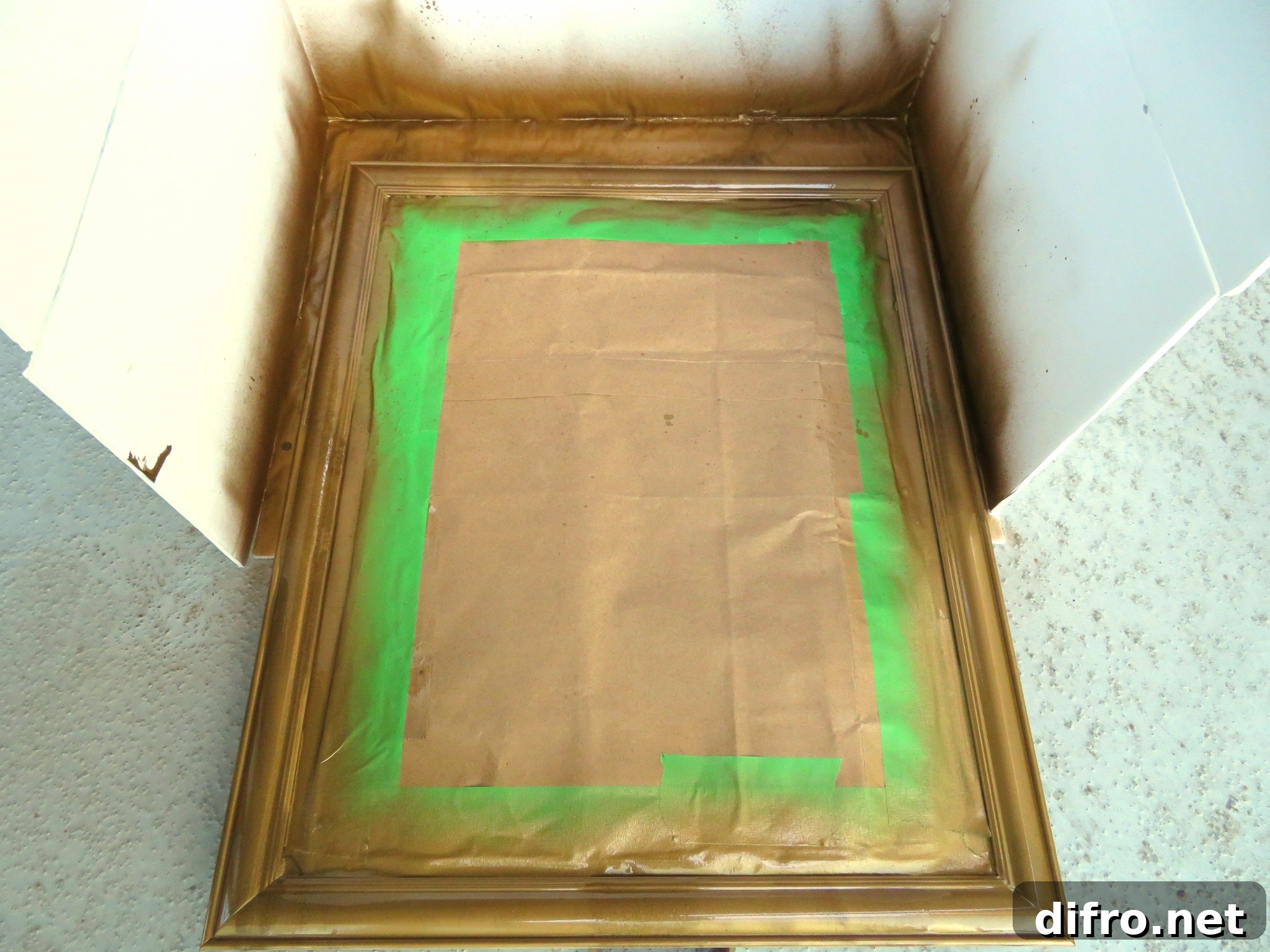Gold spray painted mirror frame for DIY project