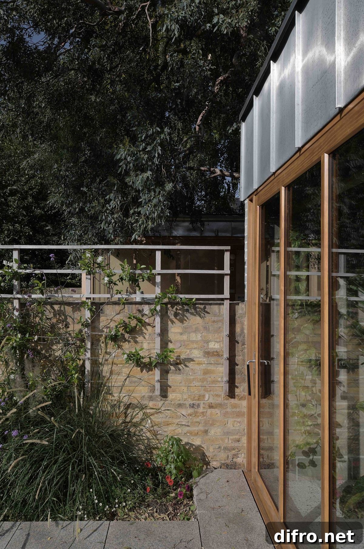 Sliding glass doors with a wooden offer adequate privacy while bringing the outdoors inside