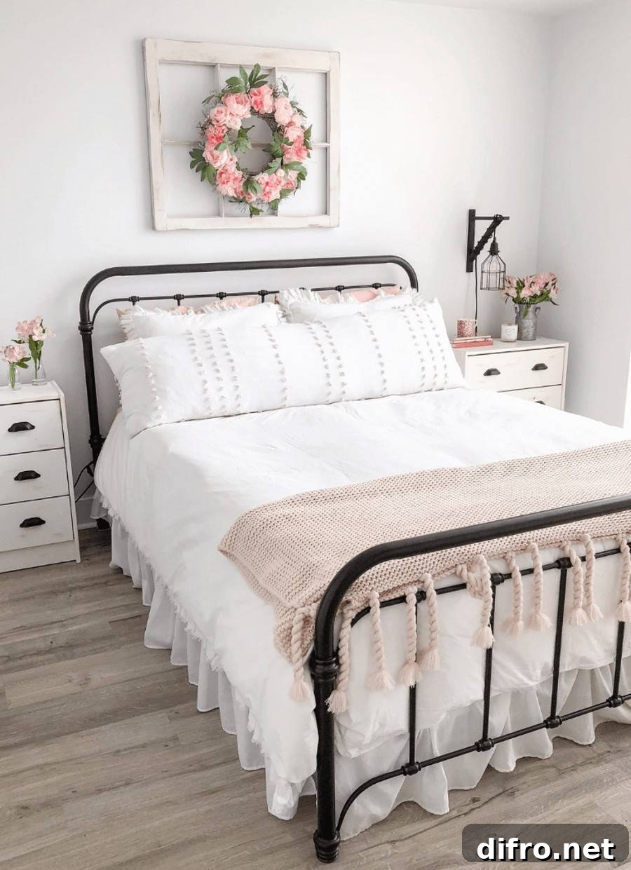 pink floral wreath mounted above bed