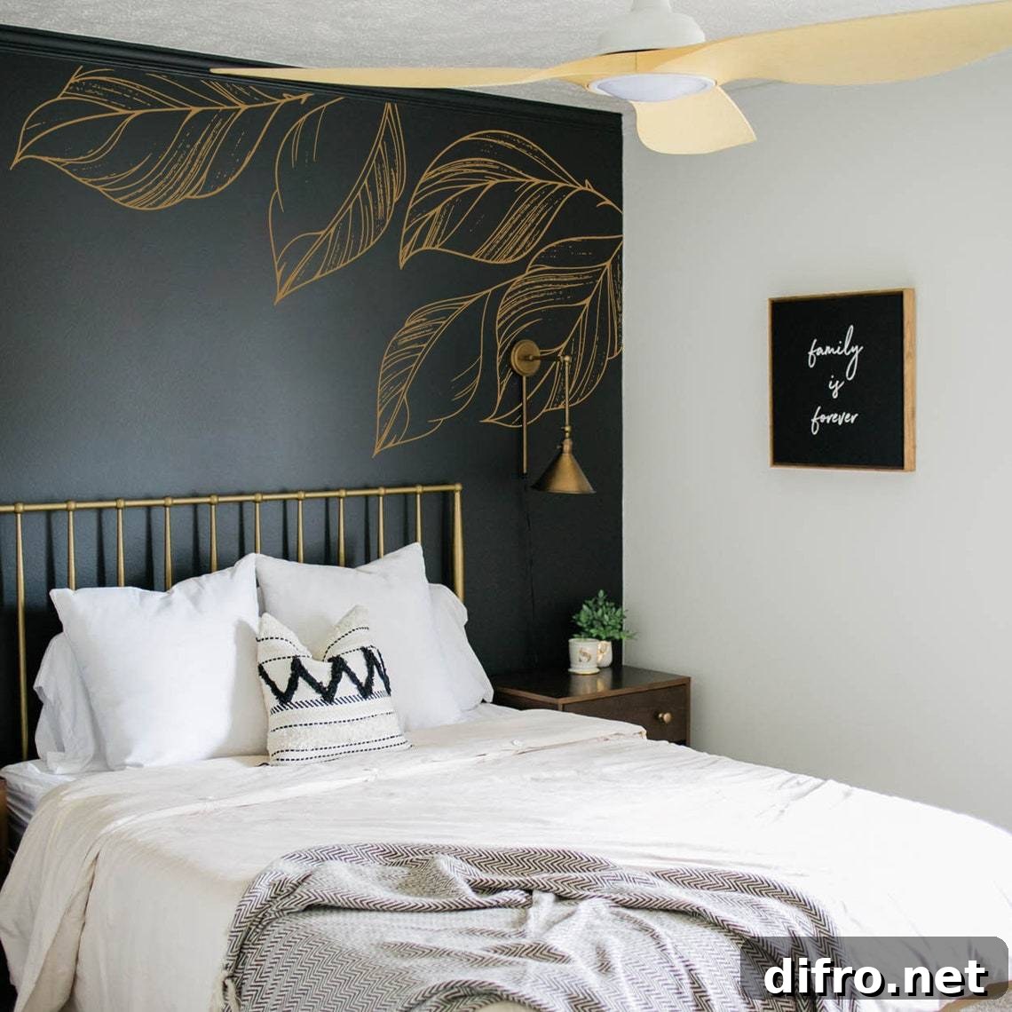 gold leaf accents on black bedroom wall