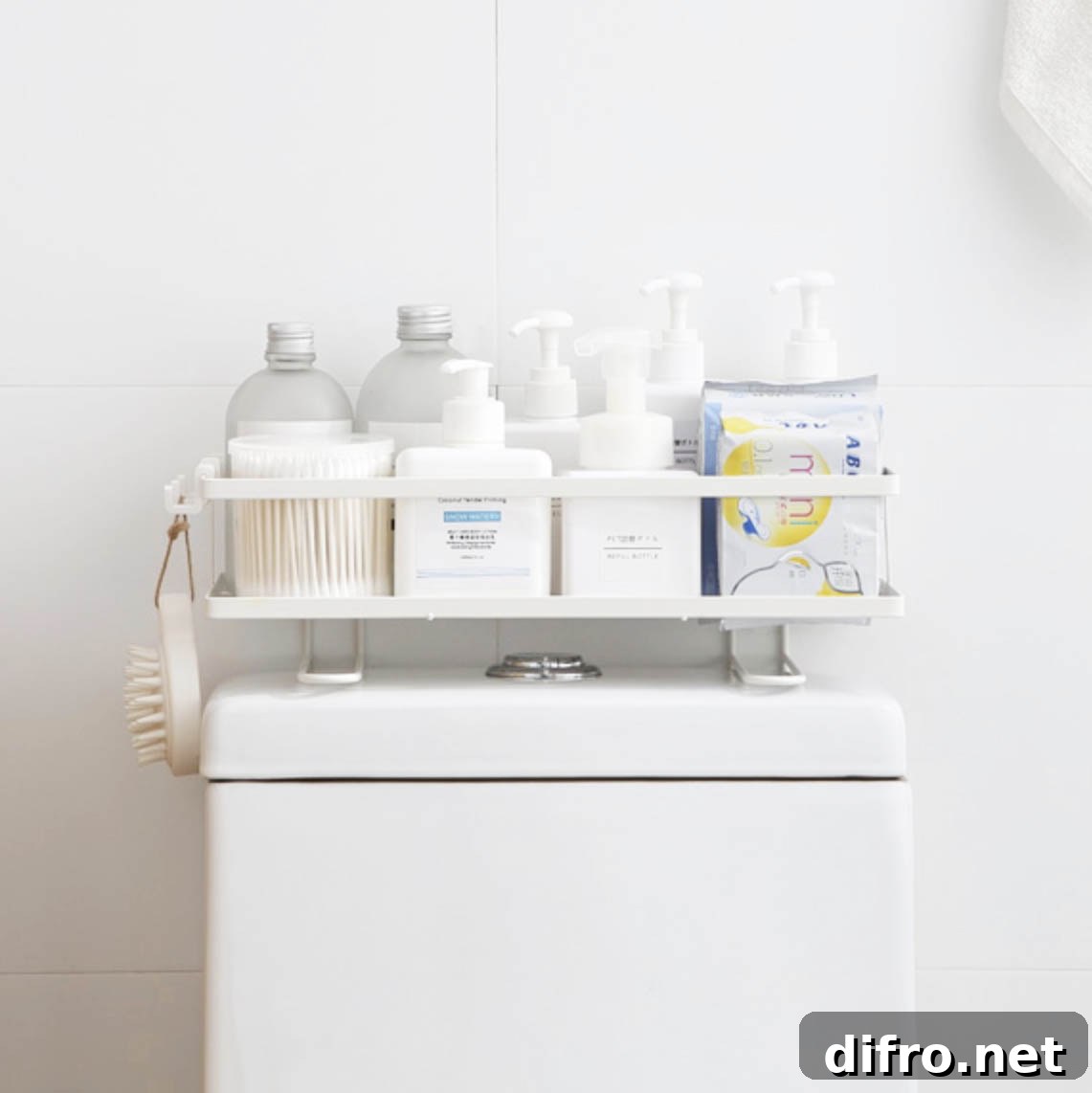 Toiletries in organizer rack placed on top of toilet