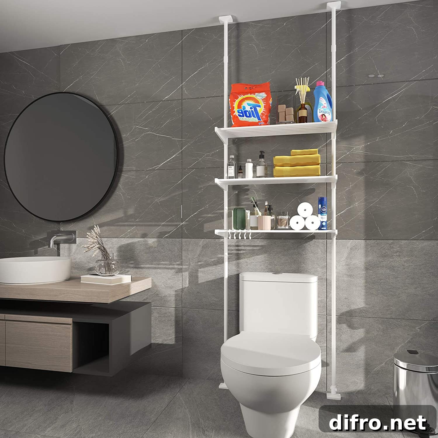 Three-layer adjustable shelf hooked from ceiling to wall in a gray tone bathroom with round mirror