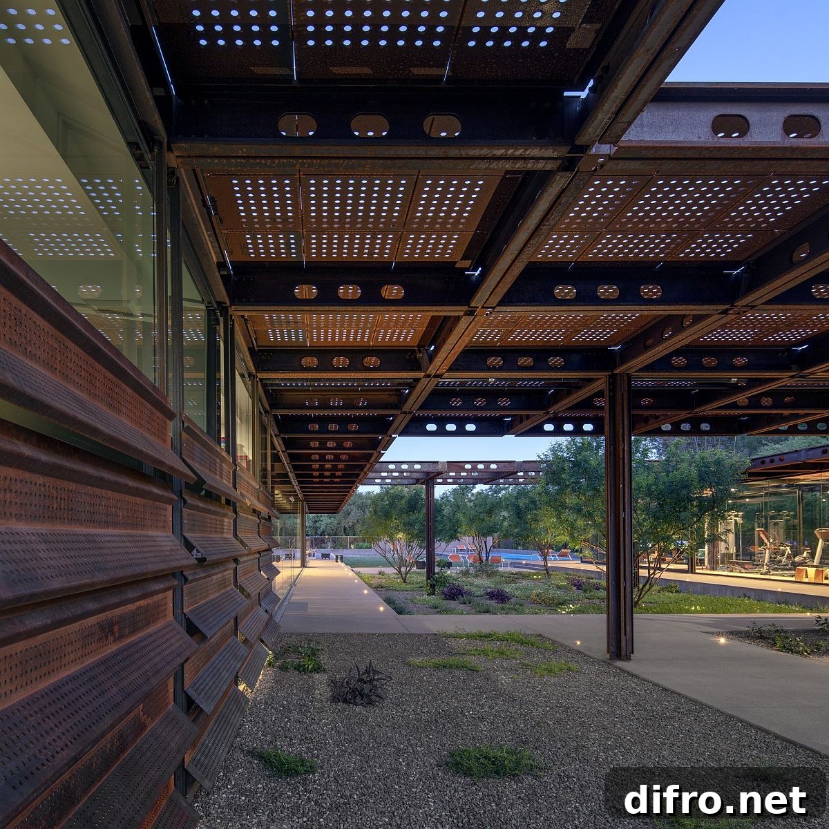 Extended Corten steel roof of the home that adds shade to the outdoor hangouts