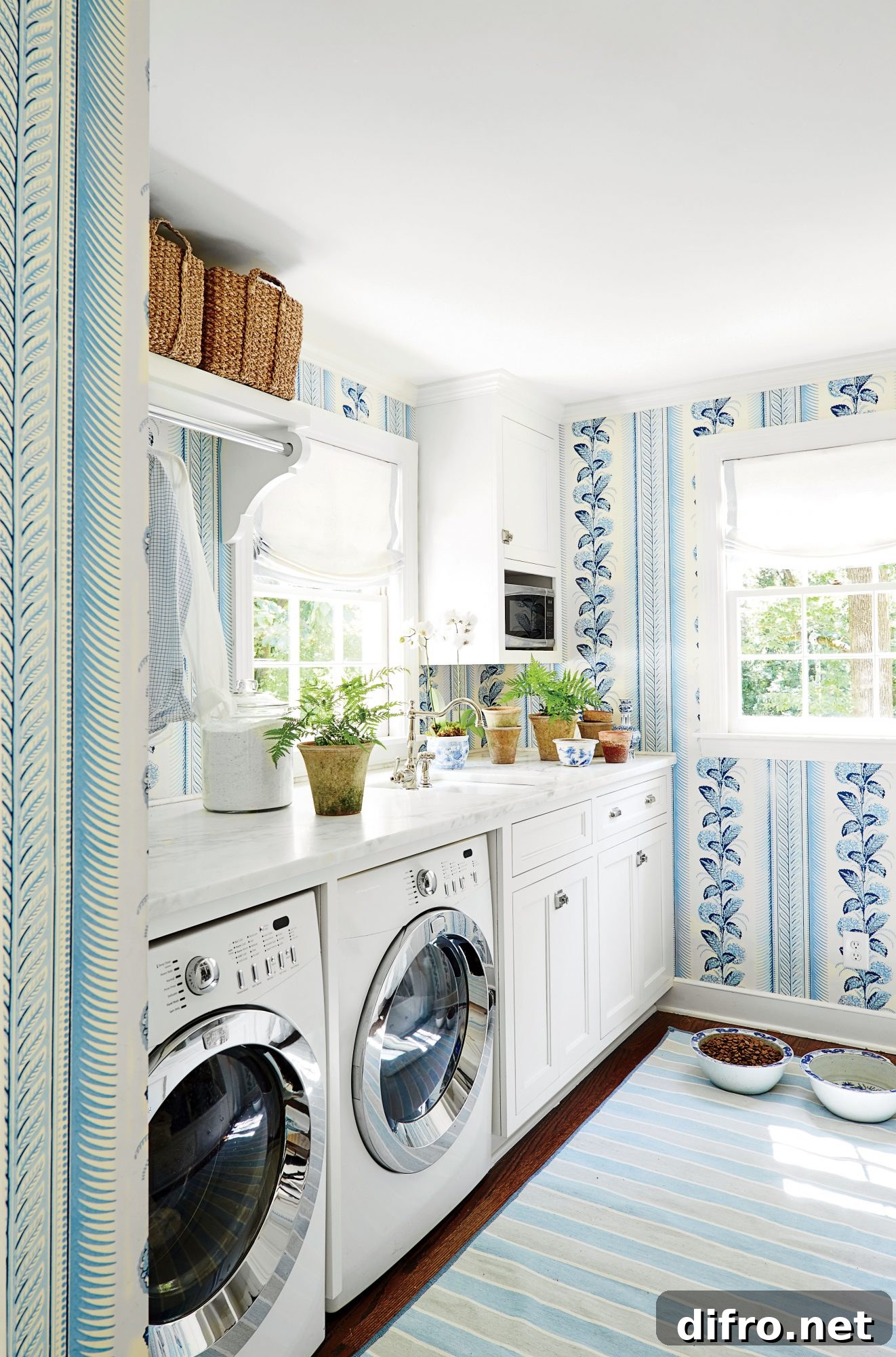 Laundry room with blue wallpaper and small potted plants