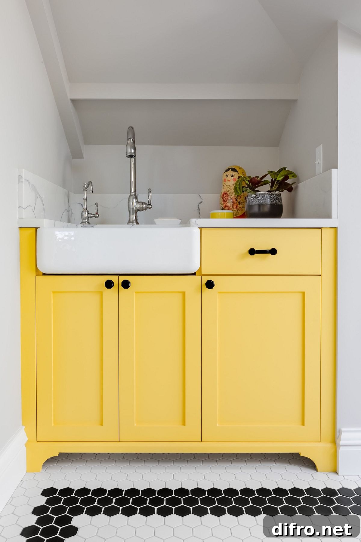 Yellow kitchen cabinets in a neutral interior