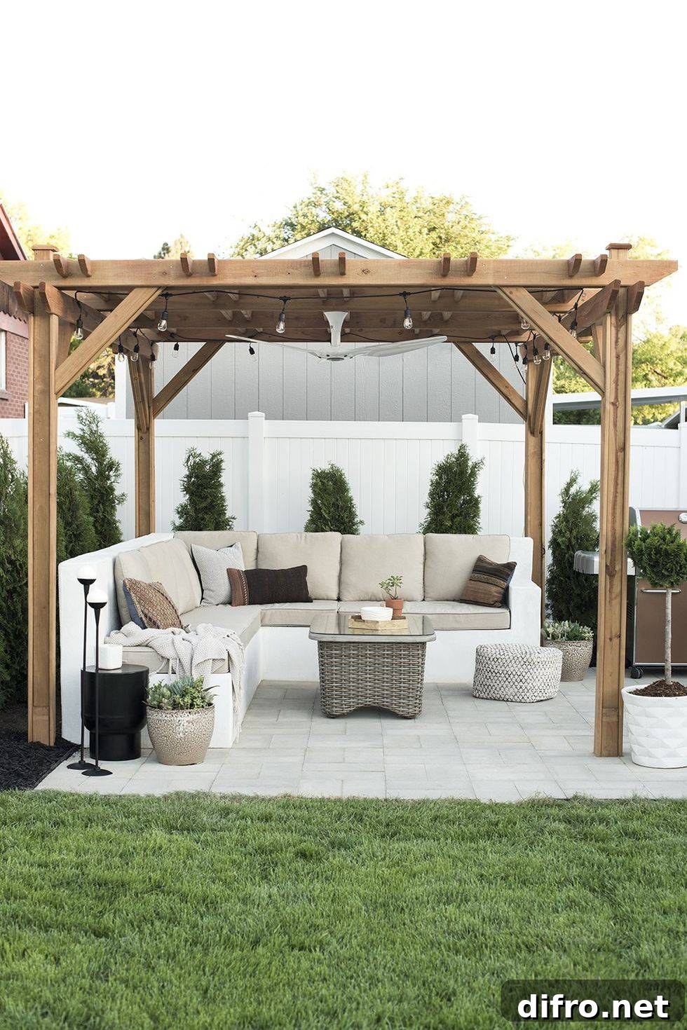 Light wood pergola in a backyard with sectional seating