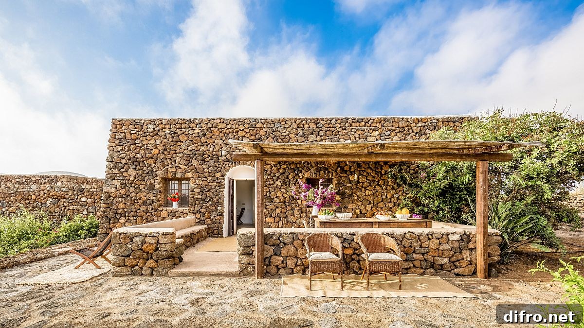 Mediterranean-style home and pergola built with traditional materials