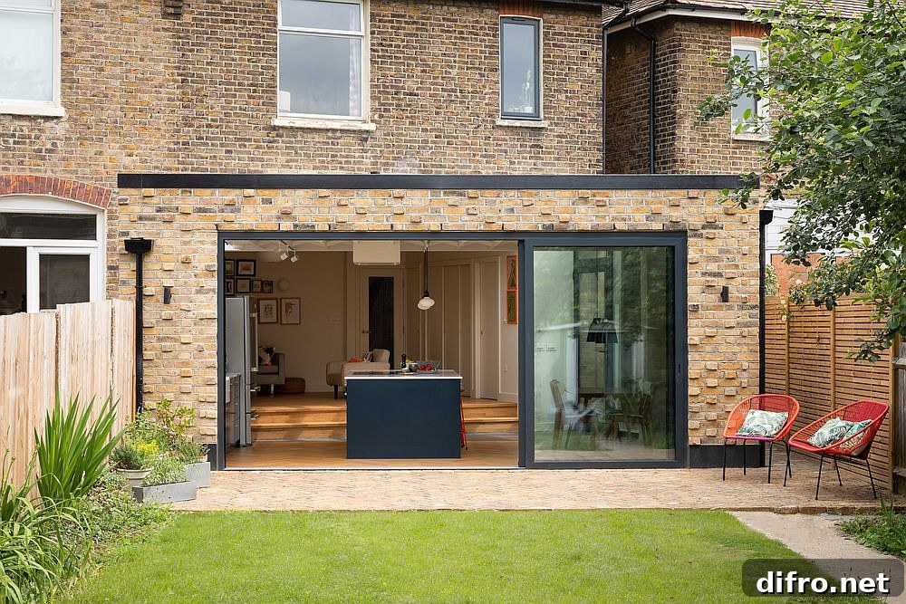 Sliding glass doors connecting the kitchen to the garden terrace