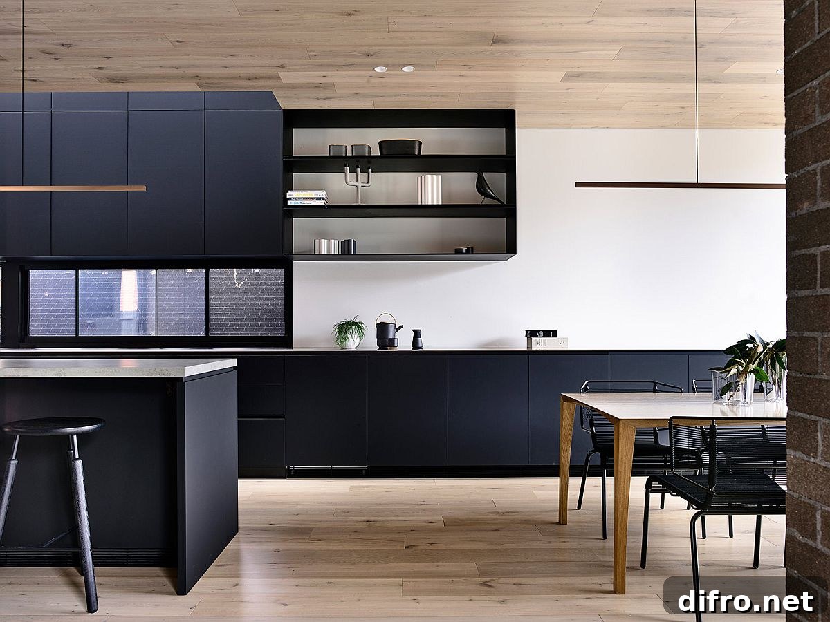 Bluish-gray kitchen island and cabinets bring contemporary panache to the new home interior