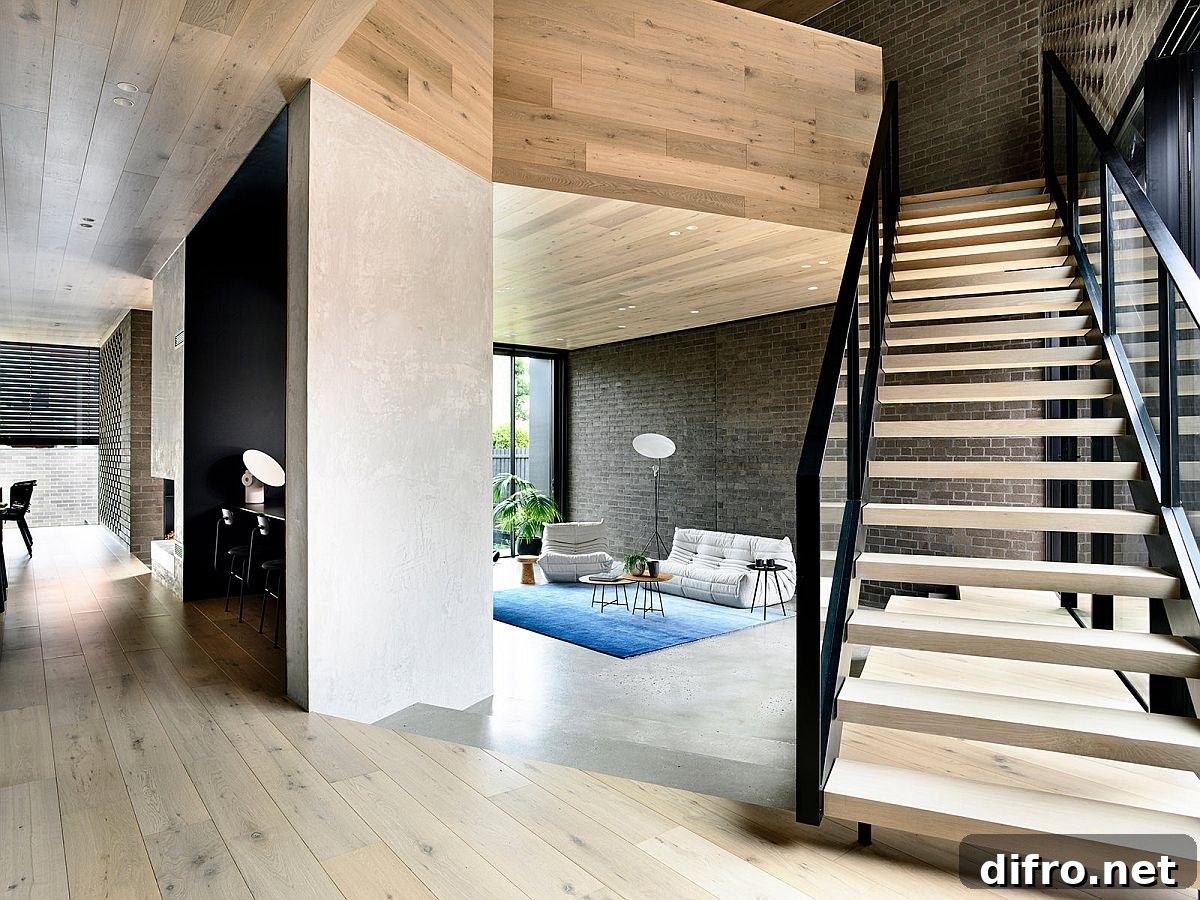 New, open plan living area of the house on the lower level with raised platforms creating series of spaces