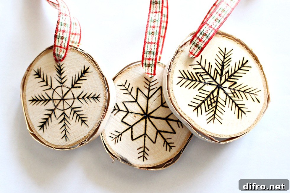 Three carved rounded Christmas ornaments with ribbon