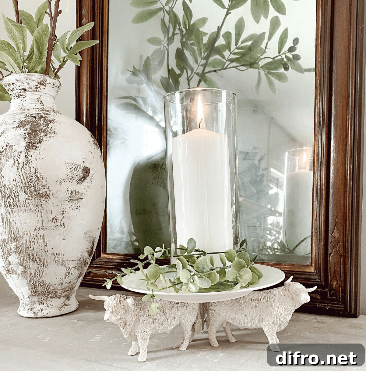 white candle holder with highland bulls pillar candles