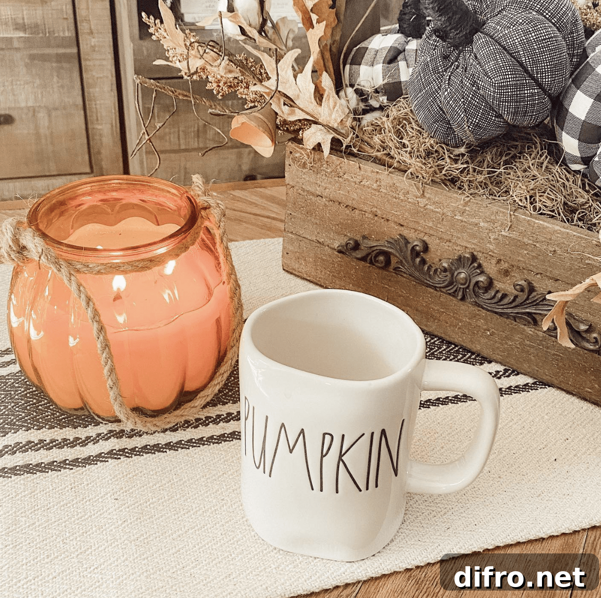glass pumpkin candle on coffee table