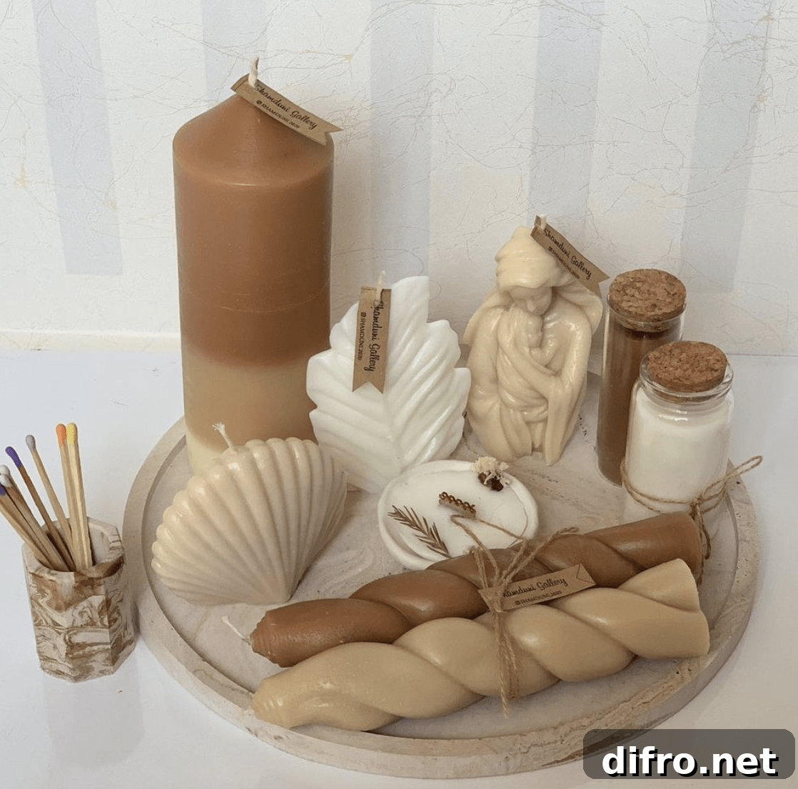 neutral candles different shapes on a tray