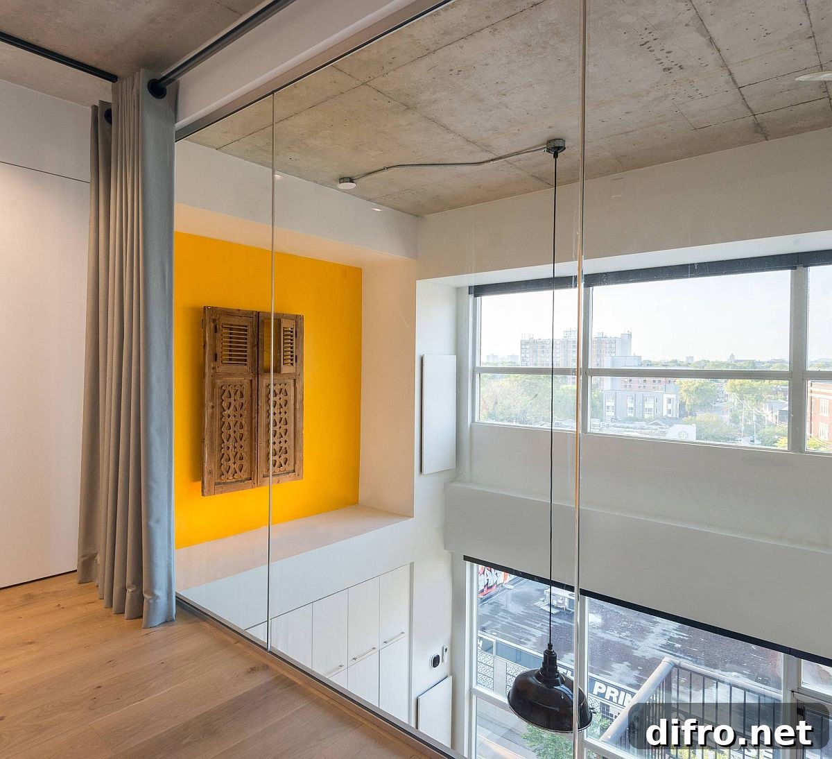 Yellow accent feature with reclaimed window shutters adds color to both the levels