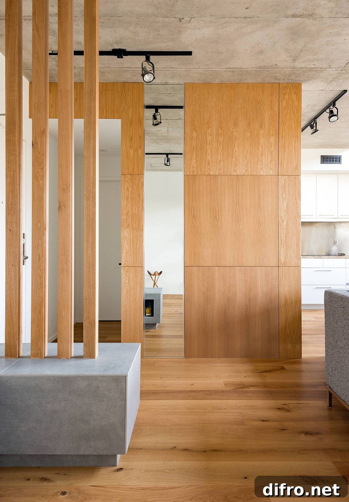 Custom wooden screens and partitions delineate space inside the open plan living area