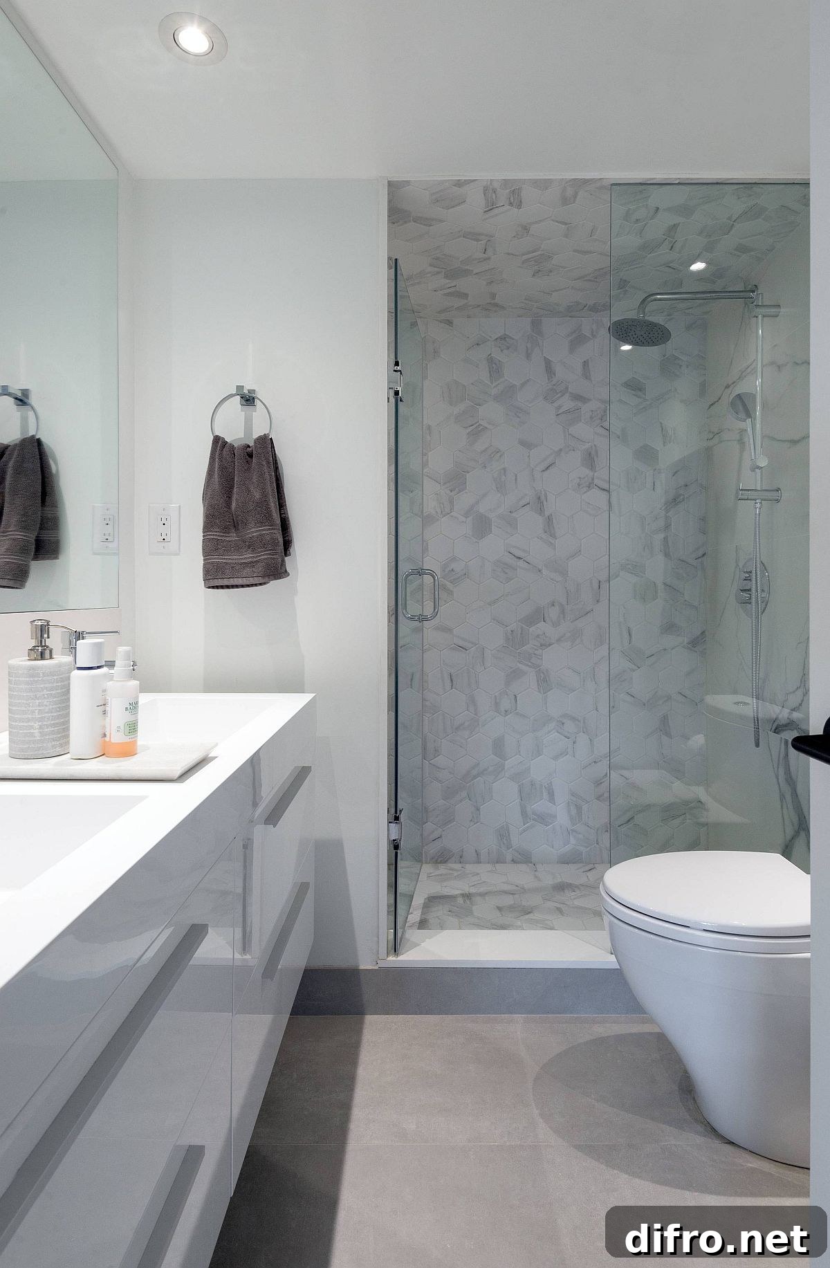 Polished contemporary bathroom of Toronto home in white and gray