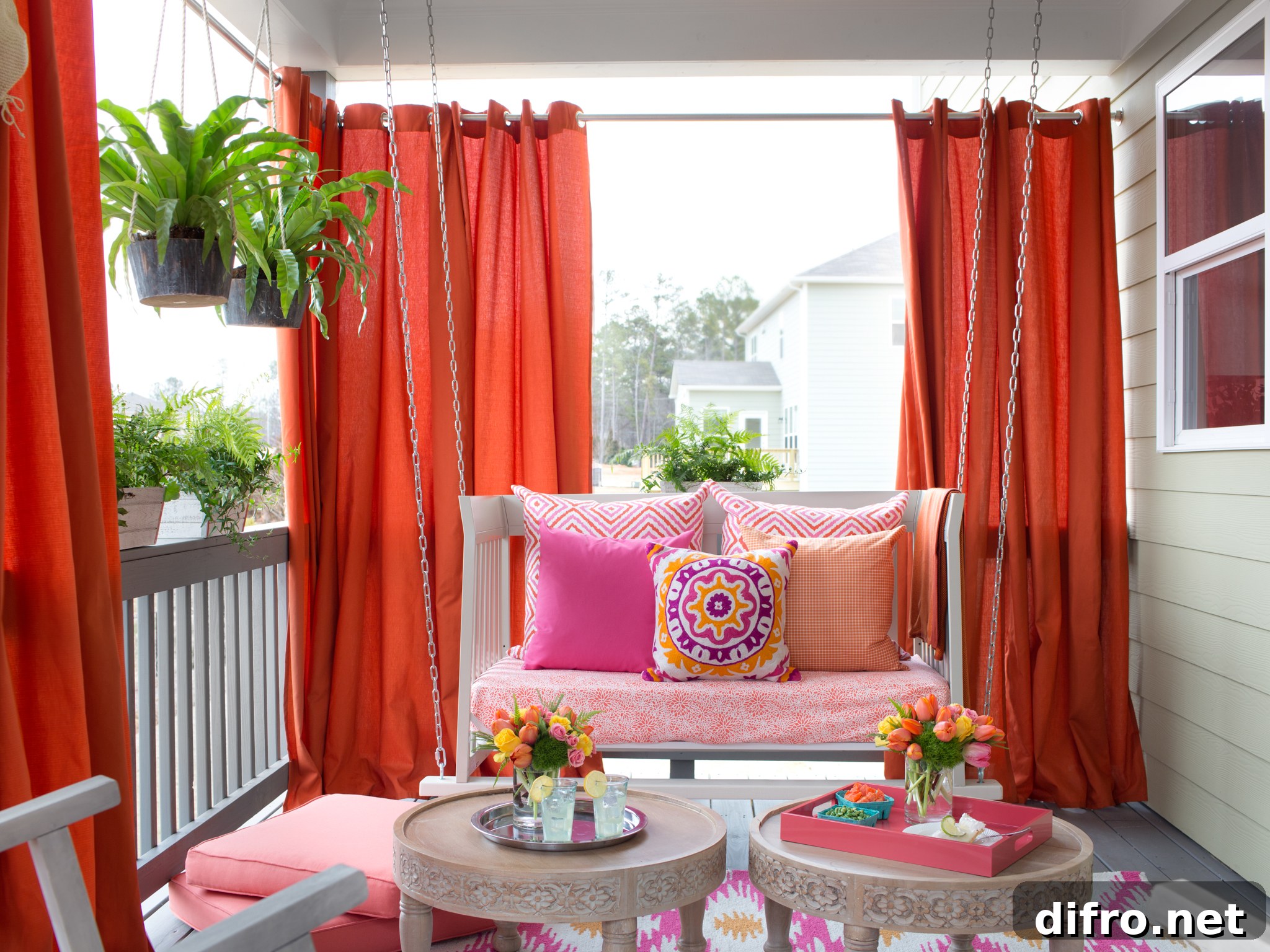 Vibrant Outdoor Space With Hanging Daybed and Draperies