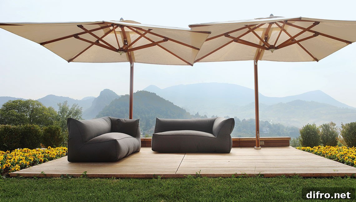 Large umbrellas shading two sofas on deck