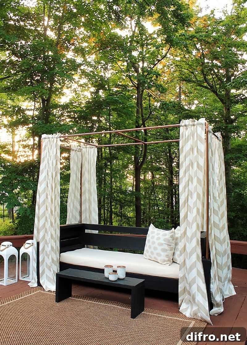 outdoor sofa with curtains hanging from copper pipes