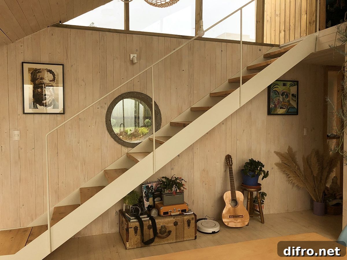 Elegant modern interior with a slim wooden staircase