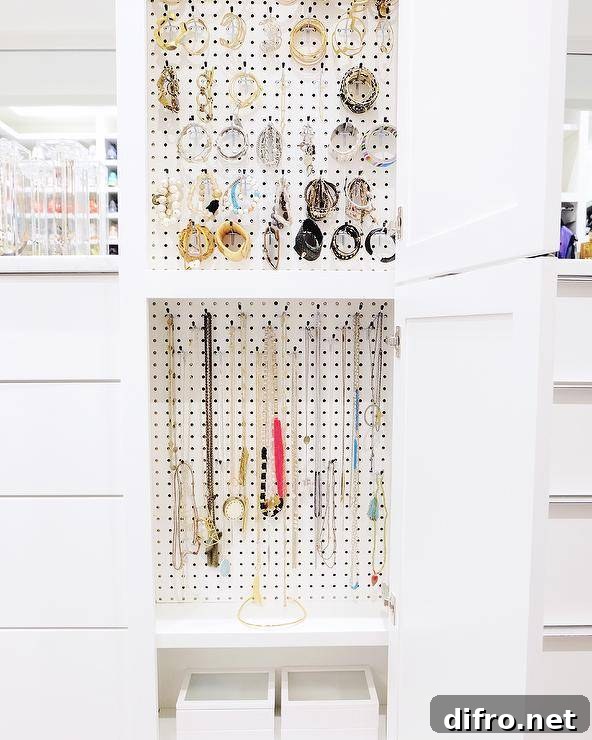 jewelry pegboard hanging organizer in white closet
